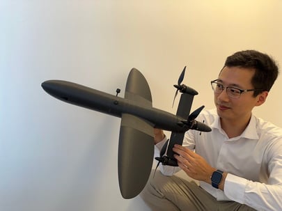 John Lou, an aerospace engineer and startup founder developing a custom tailsitter drone.